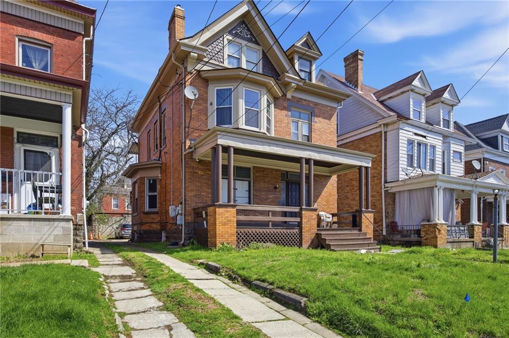 1712 Termon Avenue Pittsburgh, PA 15212 - Photo 2 of 38 front view of a brick house with a yard