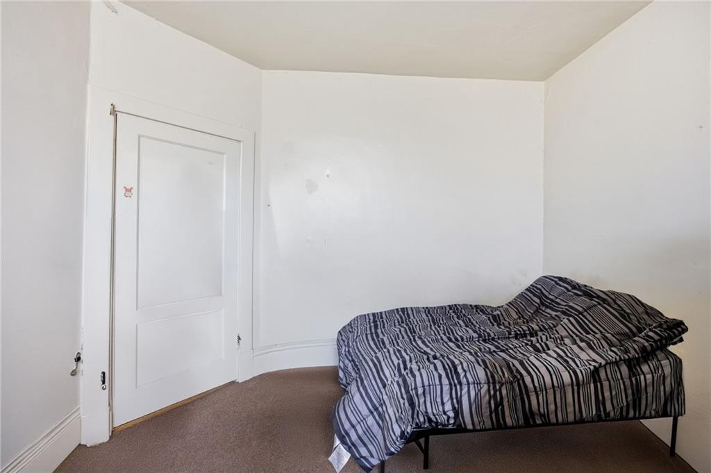 1712 Termon Avenue Pittsburgh, PA 15212 - Photo 22 of 38 a bedroom with a bed and a window