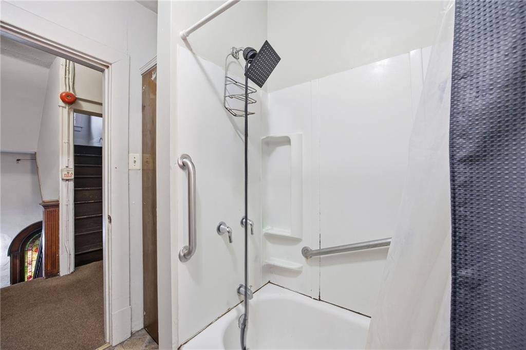 1712 Termon Avenue Pittsburgh, PA 15212 - Photo 23 of 38 a bathroom with a shower and a glass door
