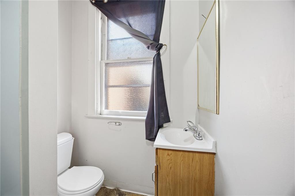 1712 Termon Avenue Pittsburgh, PA 15212 - Photo 25 of 38 a bathroom with a toilet sink and mirror
