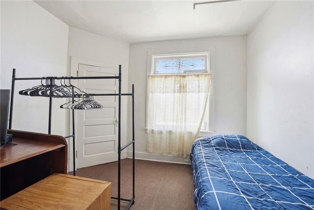 1712 Termon Avenue Pittsburgh, PA 15212 - Photo 28 of 38 a room with a bed and a window