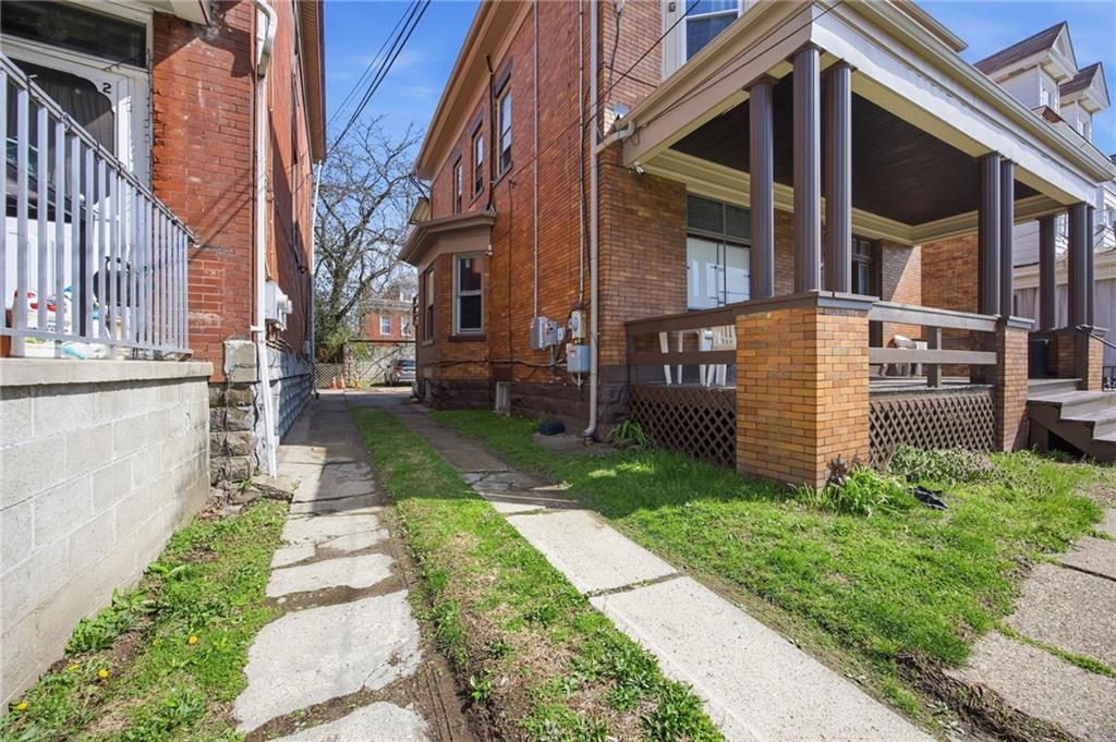 1712 Termon Avenue Pittsburgh, PA 15212 - Photo 5 of 38 a front view of a house with a yard