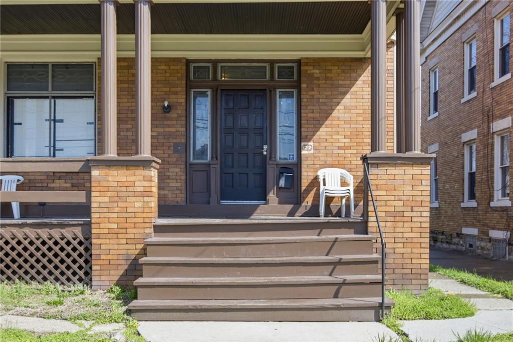 1712 Termon Avenue Pittsburgh, PA 15212 - Photo 10 of 38 a front view of a house with a iron gate