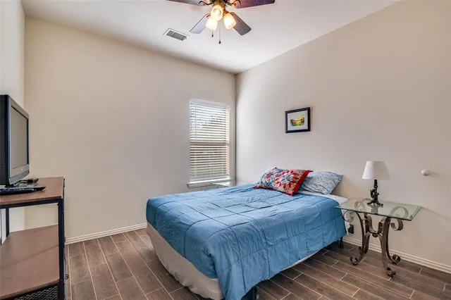 a bedroom with bed and a window