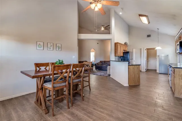 a view of a dining room with furniture and wooden floor