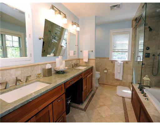 3 Indian Spring Road Rowayton, CT 06853 - Photo 13 of 20 a spacious bathroom with a double vanity sink toilet mirror and shower