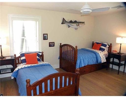 3 Indian Spring Road Rowayton, CT 06853 - Photo 16 of 20 a bedroom with two beds and wooden floor