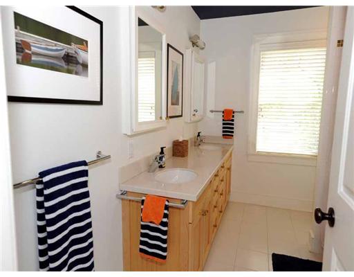 3 Indian Spring Road Rowayton, CT 06853 - Photo 17 of 20 a bathroom with a sink and a mirror