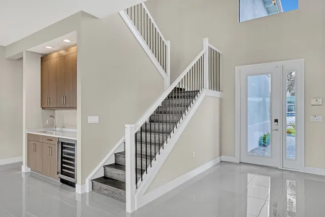 a view of entryway and hall with wooden floor