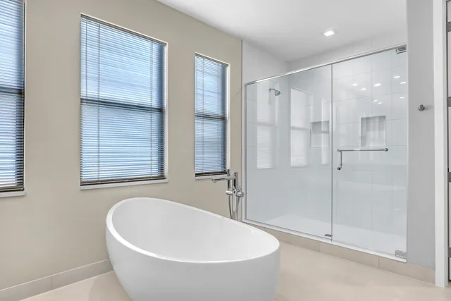 a bathroom with a bathtub and a shower