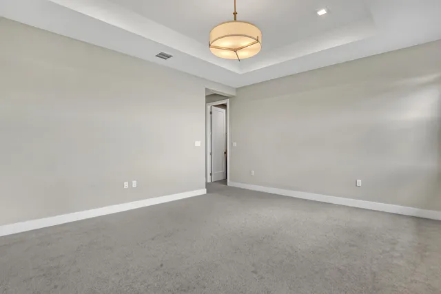 an empty room with a chandelier