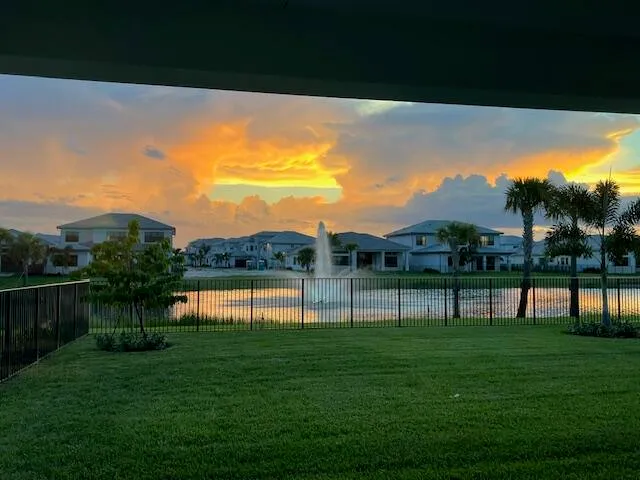 a view of a lake with a big yard