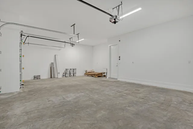 a view of a room with rack and a ceiling fan