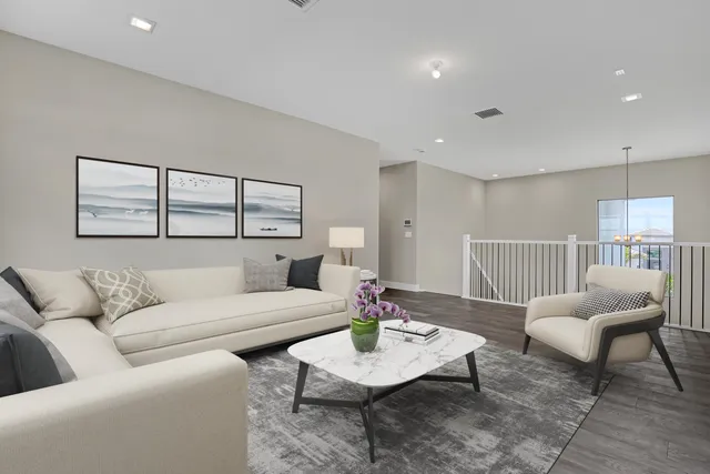 a living room with furniture and a table