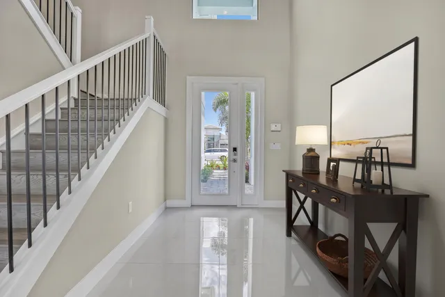 a view of entryway and hall with wooden floor