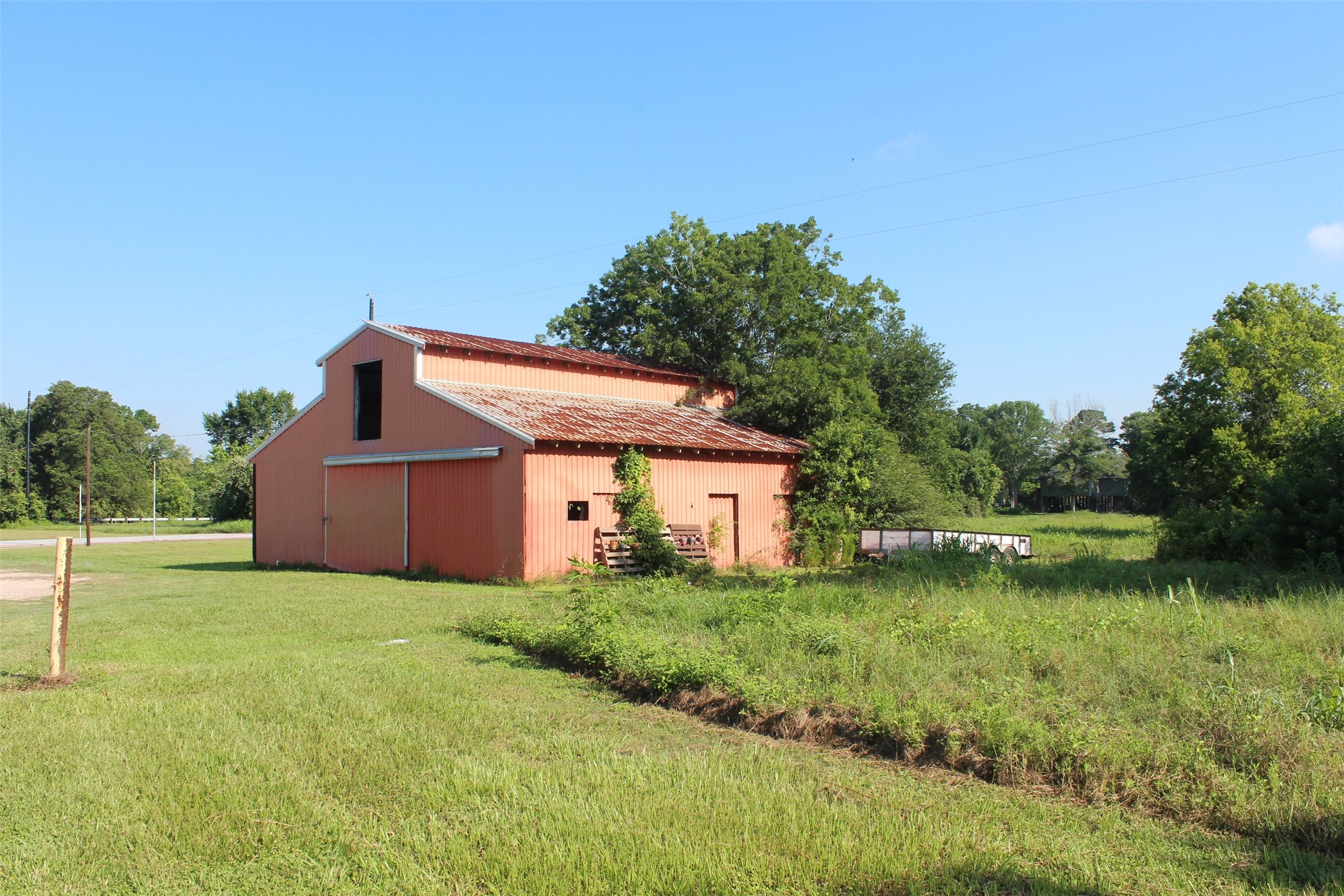 4531 Curry Street Manvel, TX 77578 - Photo 4 of 24 a view of a house with a yard and a garden