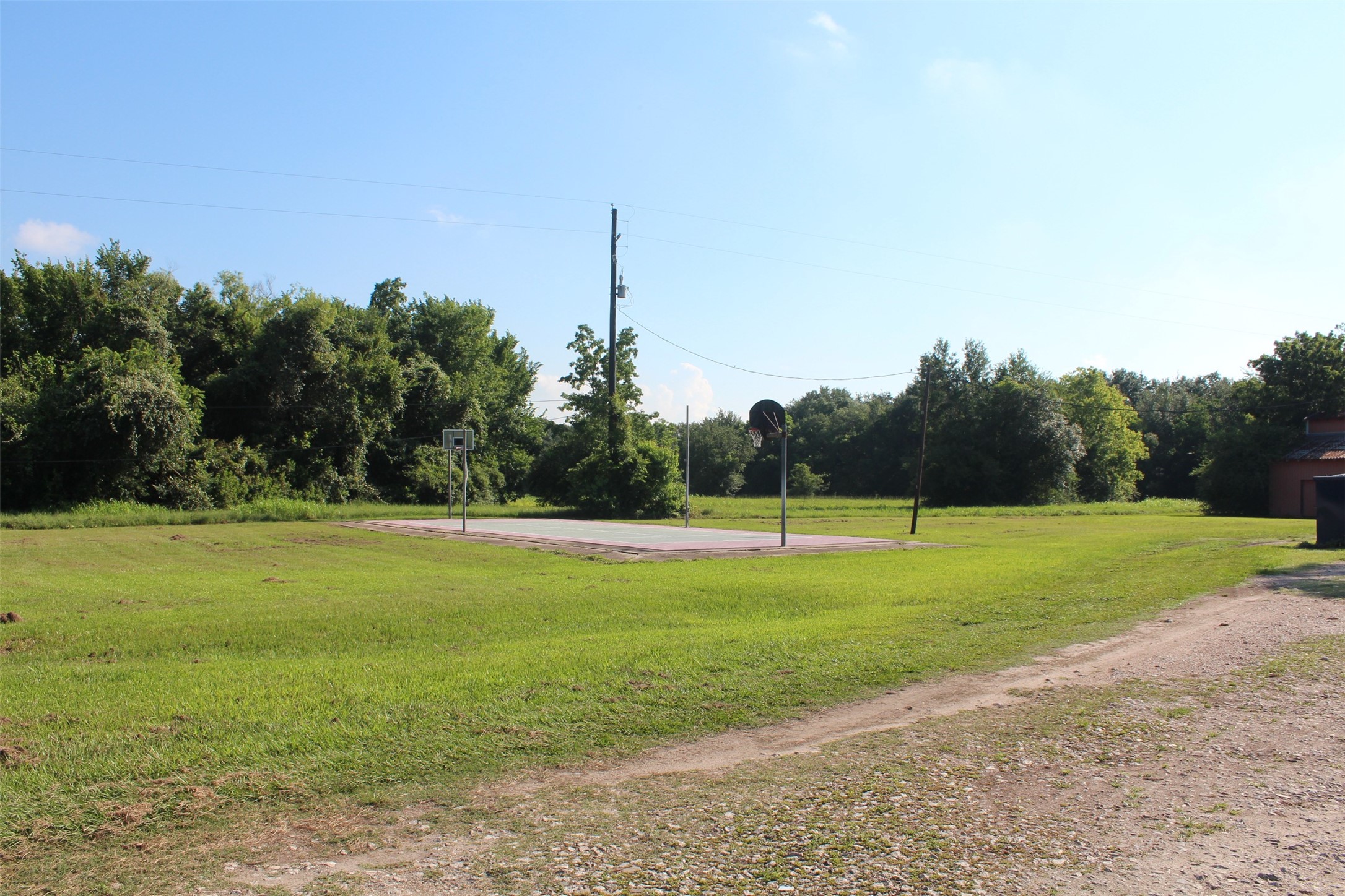 4531 Curry Street Manvel, TX 77578 - Photo 7 of 24 a view of a golf course with a lake