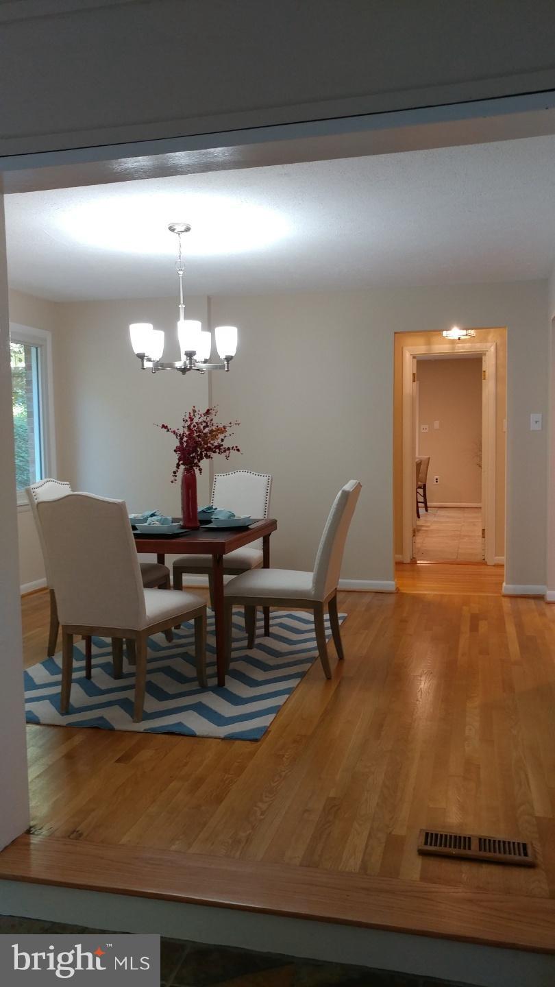 7617 Carteret Road Bethesda, MD 20817 - Photo 7 of 30 a dining room with table and chairs