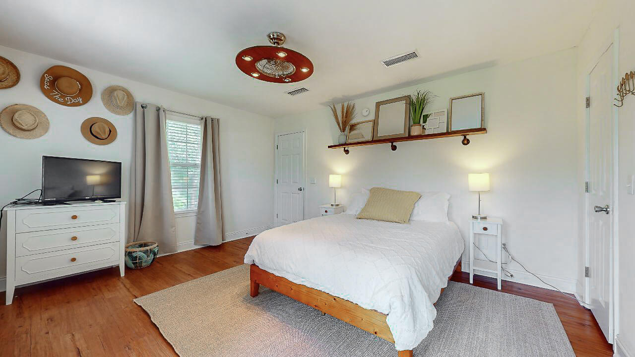 2623 Bay Grove Road Freeport, FL 32439 - Photo 20 of 56 a bedroom with a bed and flat screen tv