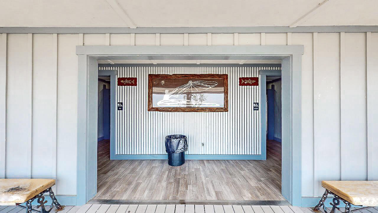 2623 Bay Grove Road Freeport, FL 32439 - Photo 53 of 56 a view of a livingroom with wooden floor and a large window