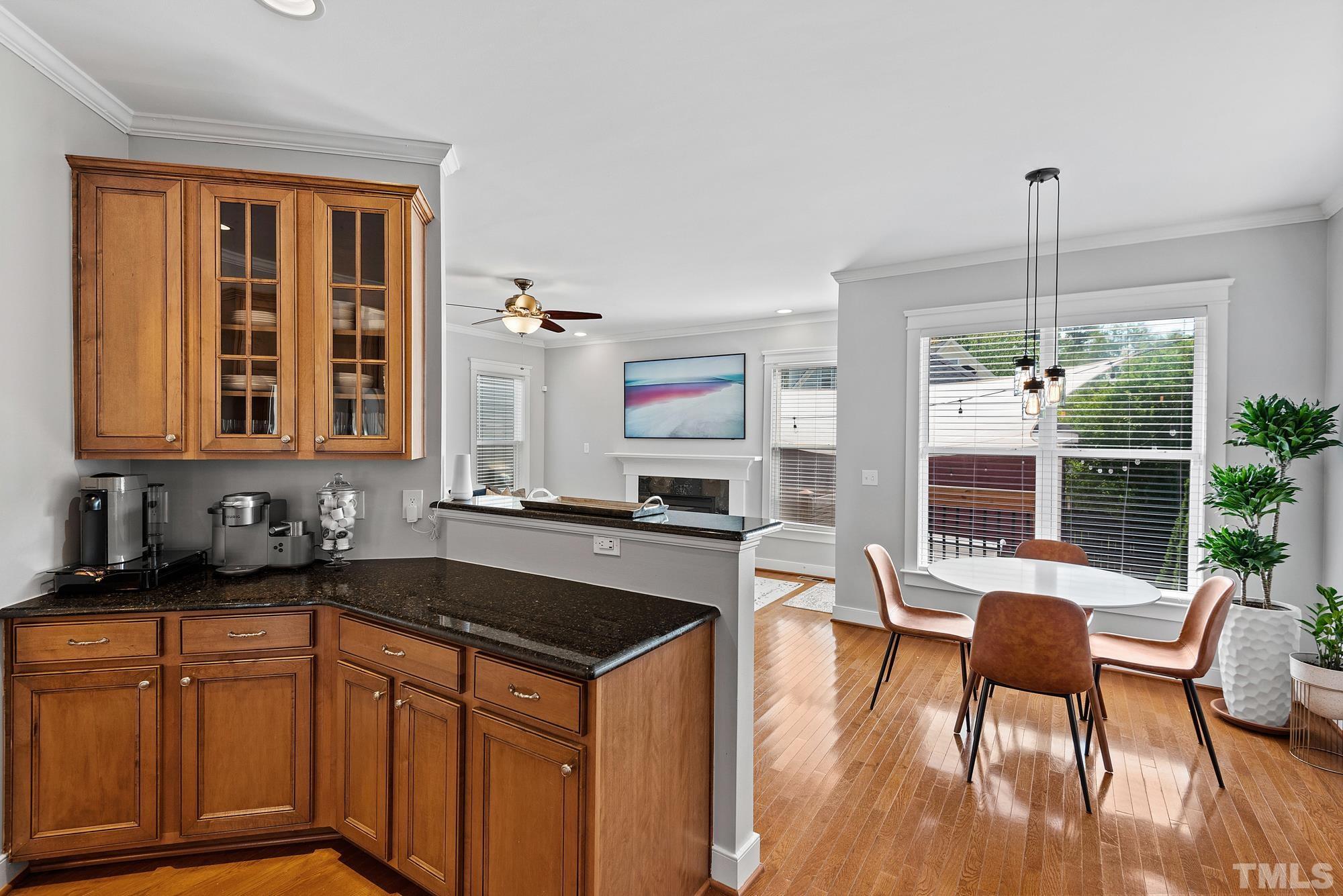 4413 All Points View Way Raleigh, NC 27614 - Photo 11 of 51 a kitchen that has a table chairs in it and wooden floors
