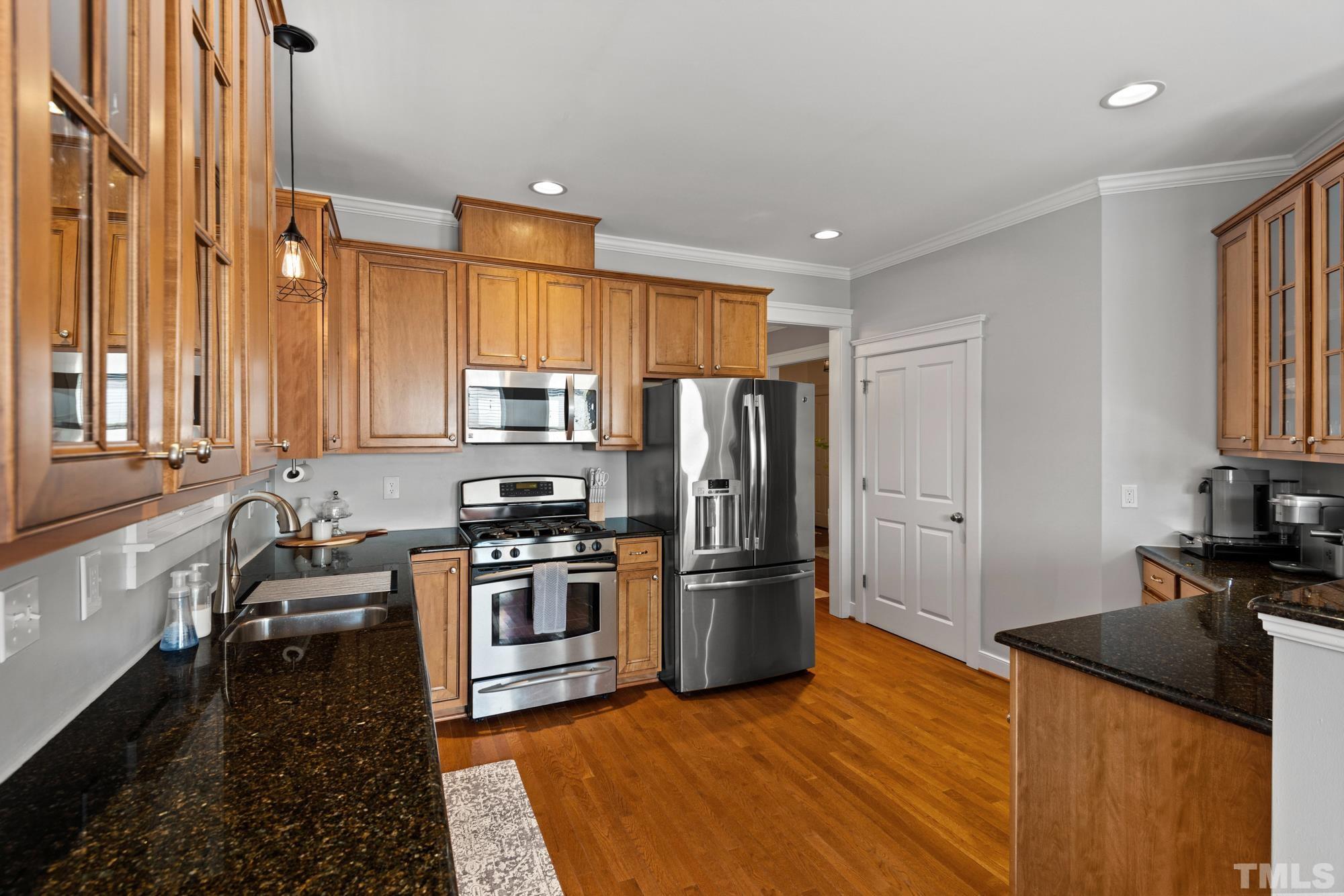 4413 All Points View Way Raleigh, NC 27614 - Photo 13 of 51 a kitchen with granite countertop a refrigerator stove and sink