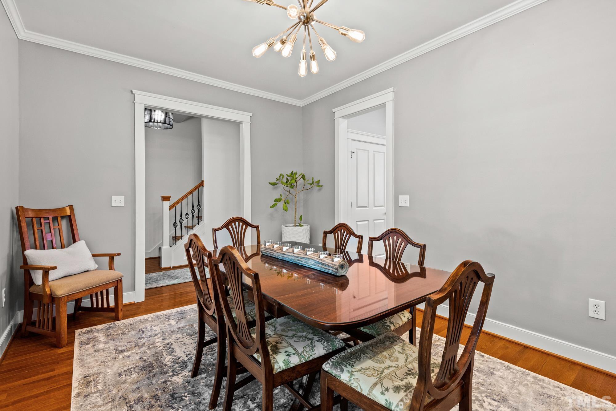 4413 All Points View Way Raleigh, NC 27614 - Photo 16 of 51 a view of a dining room with furniture and wooden floor