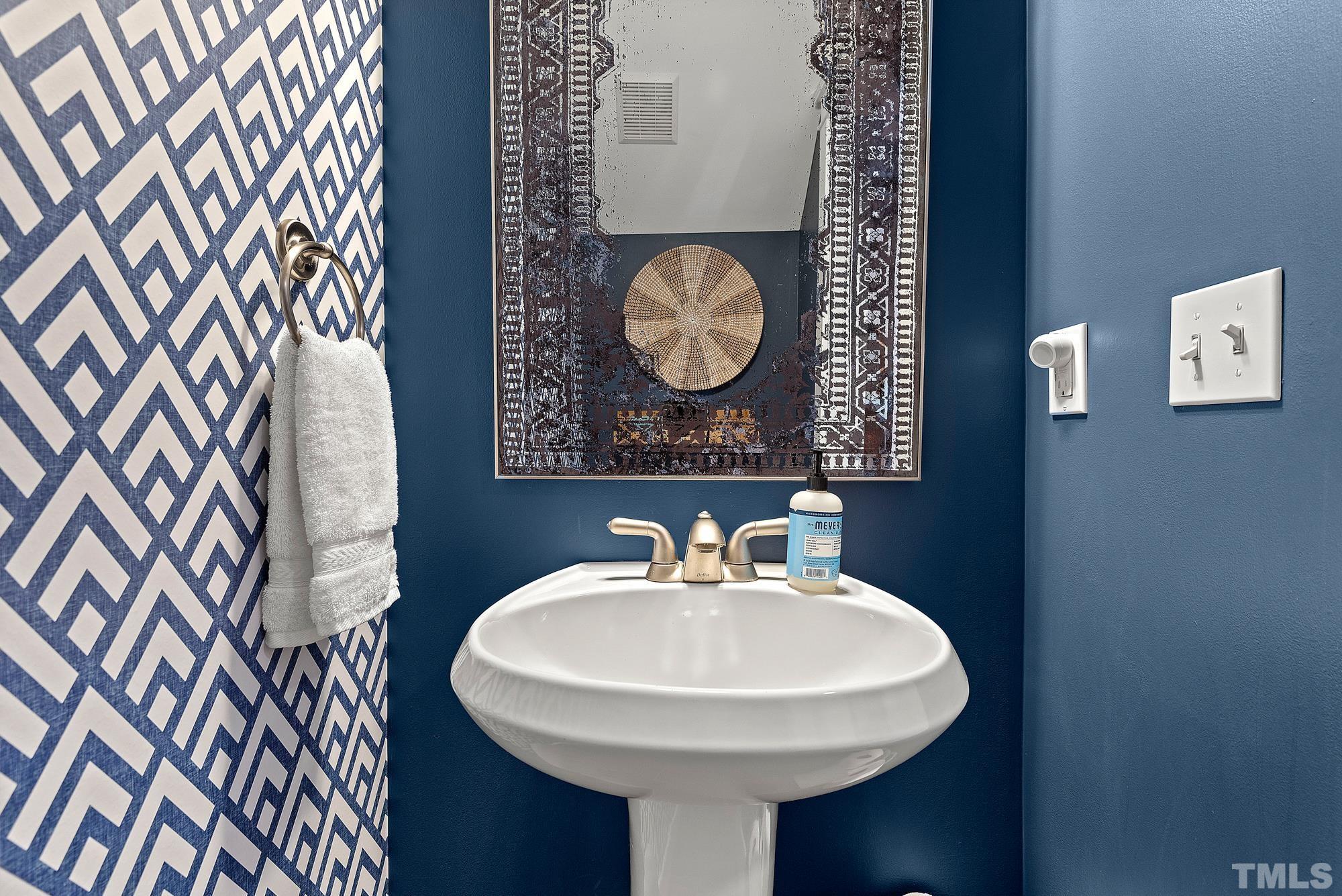 4413 All Points View Way Raleigh, NC 27614 - Photo 17 of 51 a bathroom with a sink and a mirror
