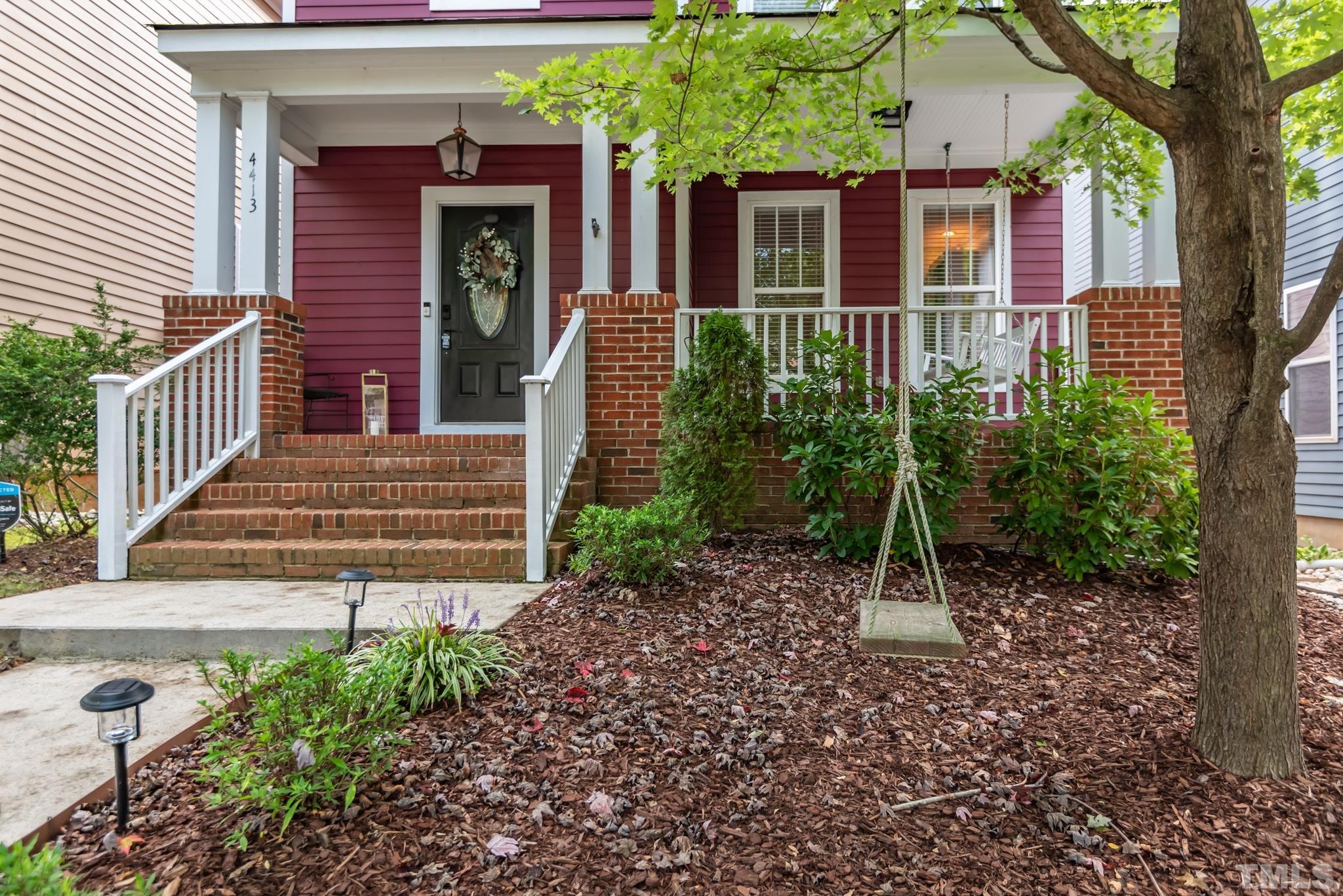 4413 All Points View Way Raleigh, NC 27614 - Photo 2 of 51 a view of a house with brick walls and flower plants