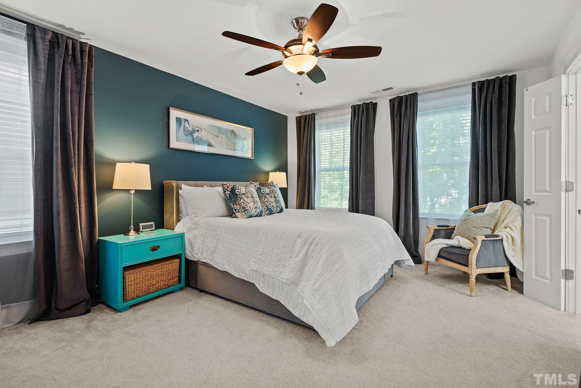 4413 All Points View Way Raleigh, NC 27614 - Photo 21 of 51 a bedroom with a bed and a chandelier