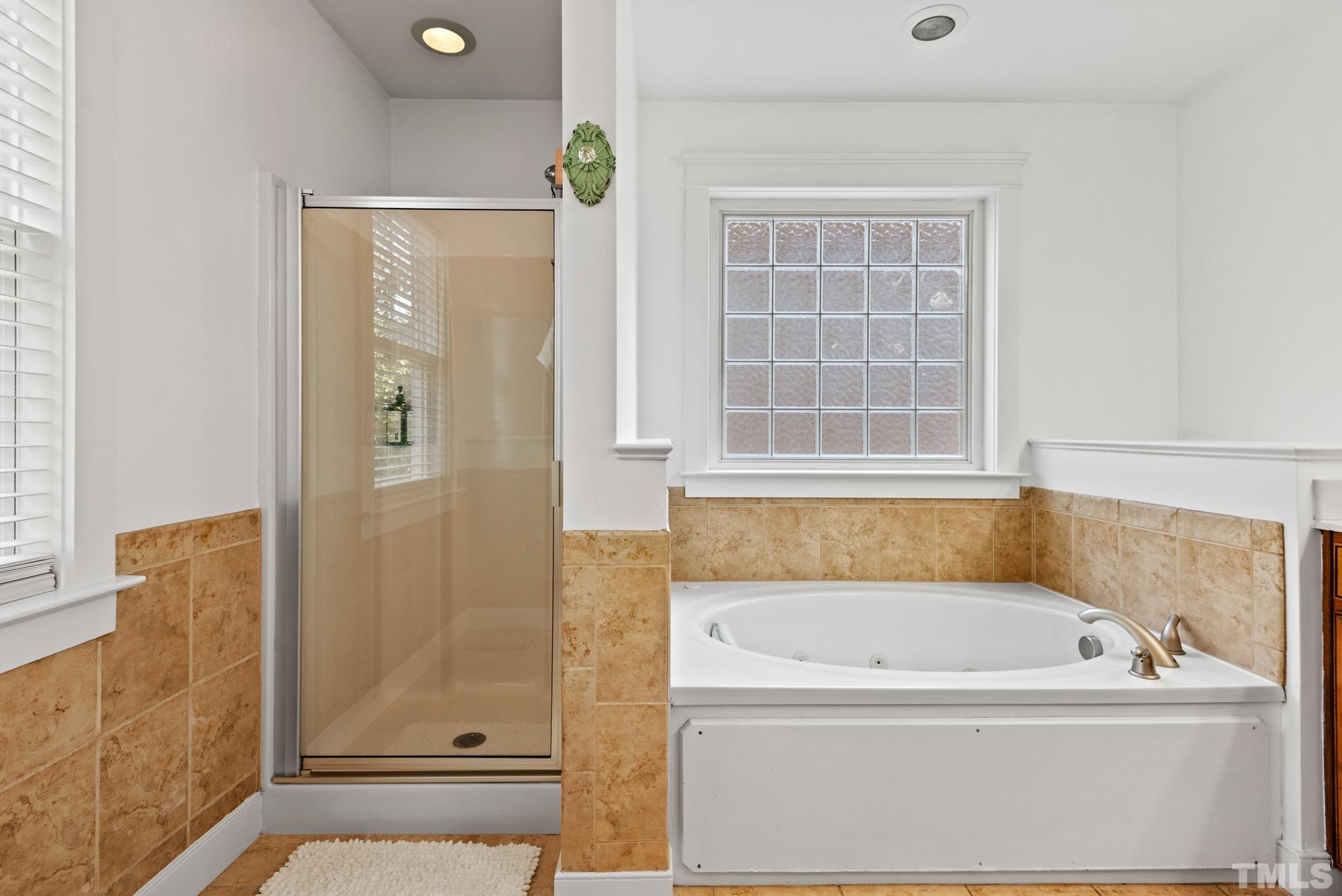4413 All Points View Way Raleigh, NC 27614 - Photo 26 of 51 a bathroom with a bathtub and shower