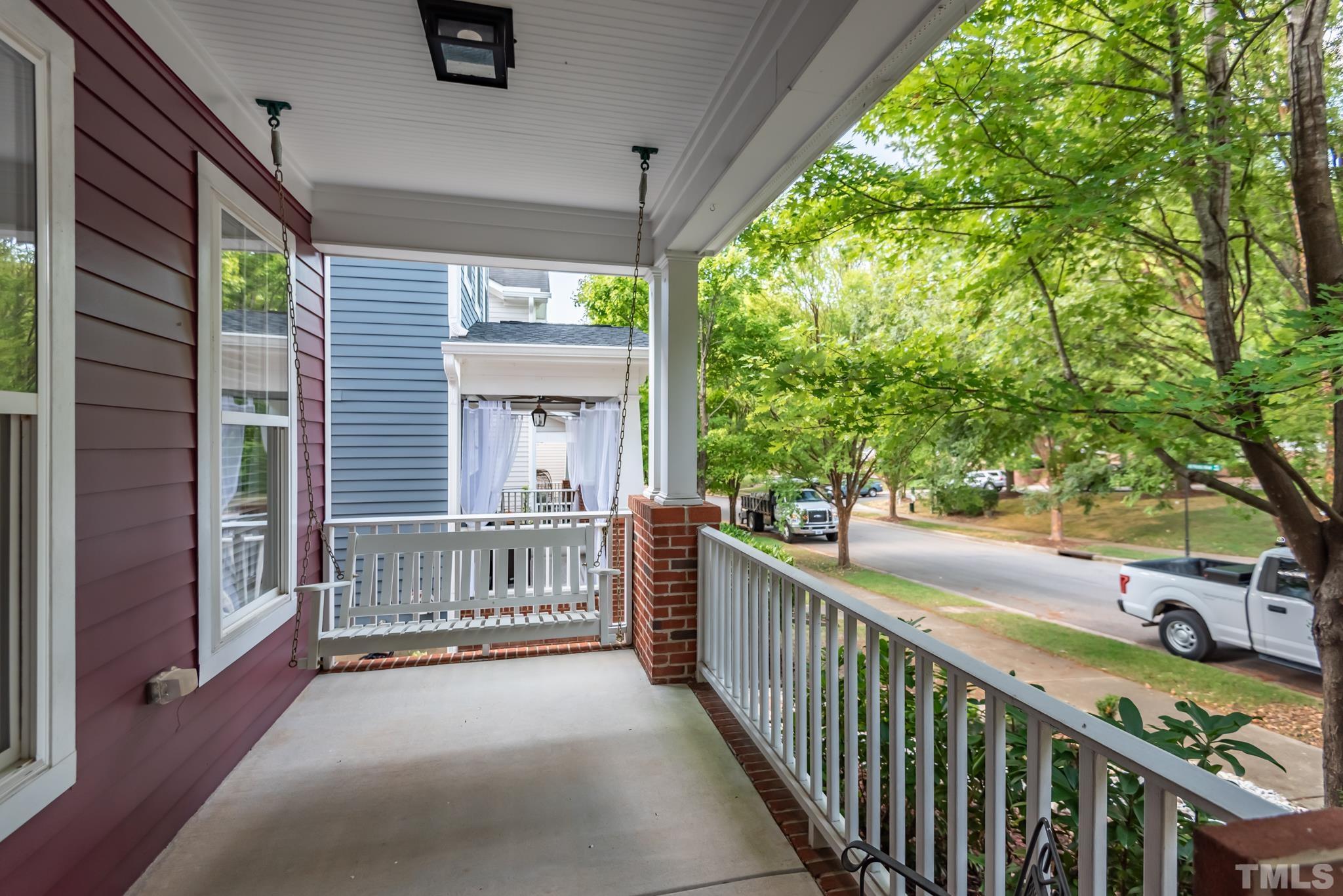 4413 All Points View Way Raleigh, NC 27614 - Photo 3 of 51 a view of a porch with wooden floor and fence