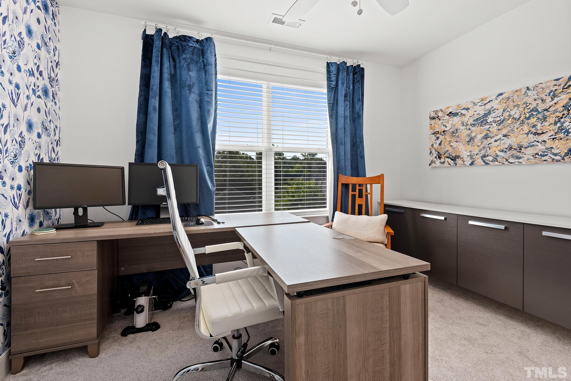 4413 All Points View Way Raleigh, NC 27614 - Photo 32 of 51 a view of a workspace with furniture and a window