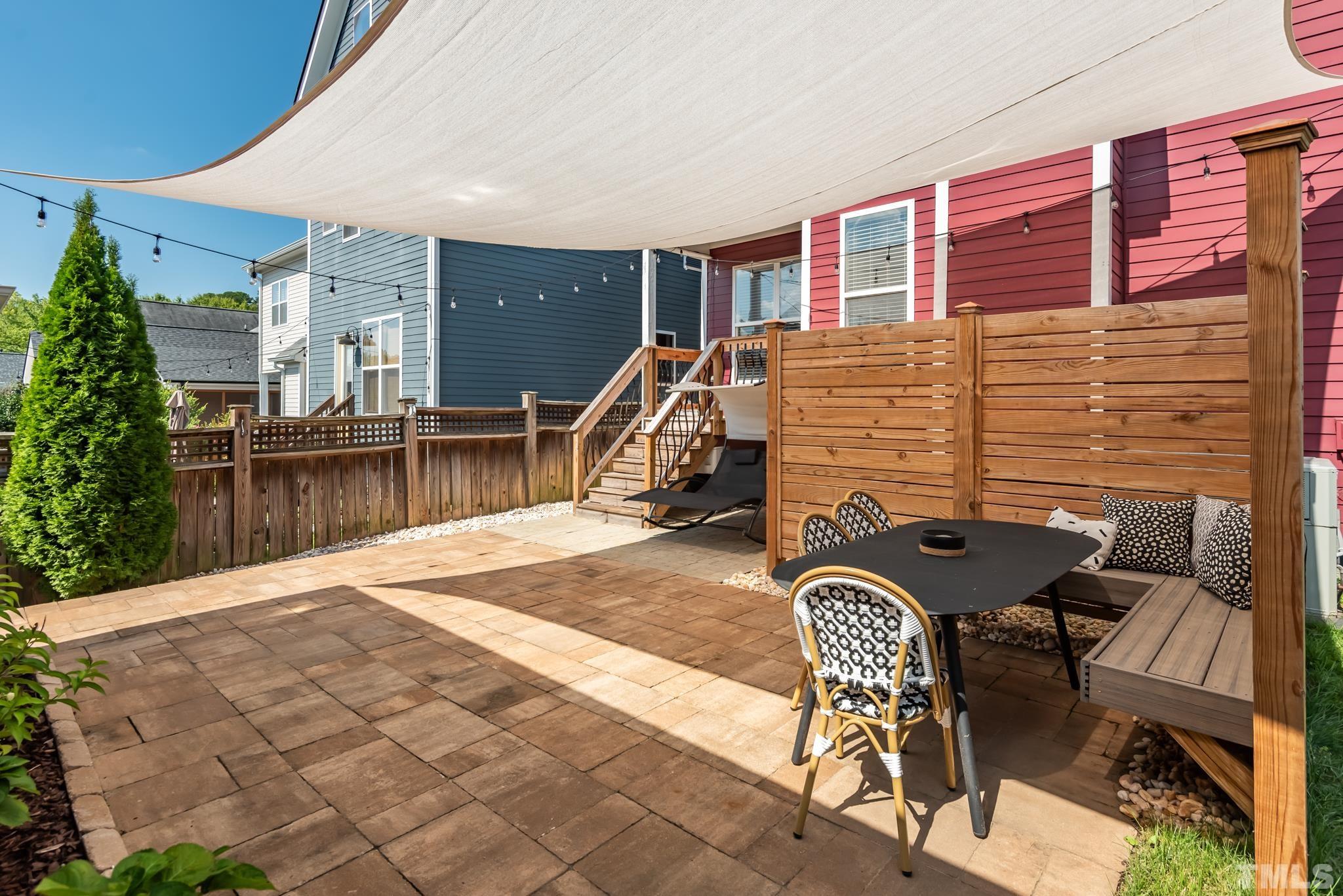 4413 All Points View Way Raleigh, NC 27614 - Photo 42 of 51 a backyard of a house with table and chairs