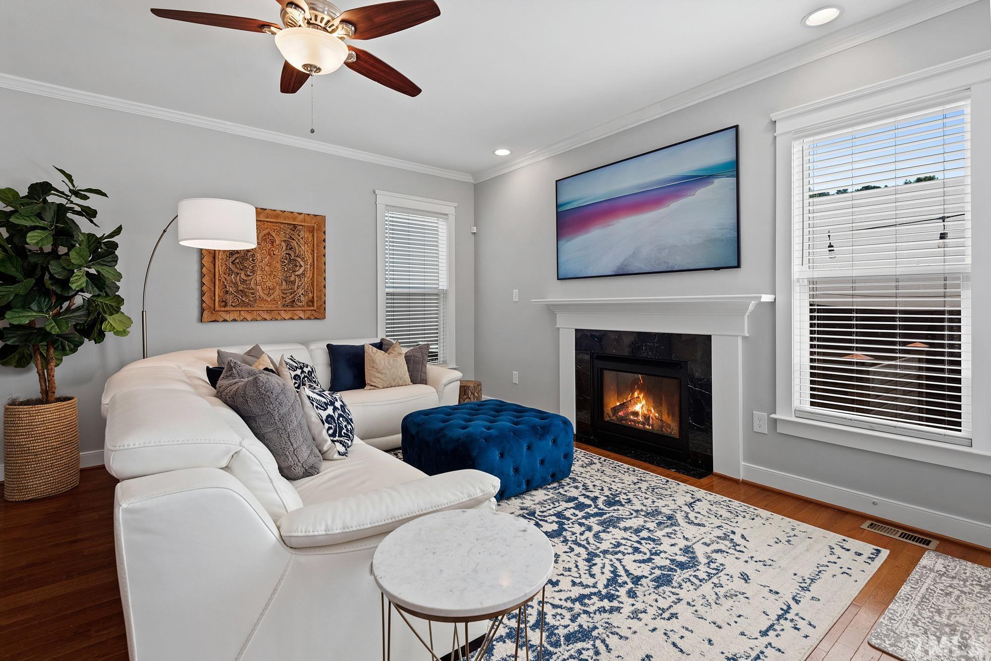 4413 All Points View Way Raleigh, NC 27614 - Photo 7 of 51 a living room with furniture a rug and a fireplace