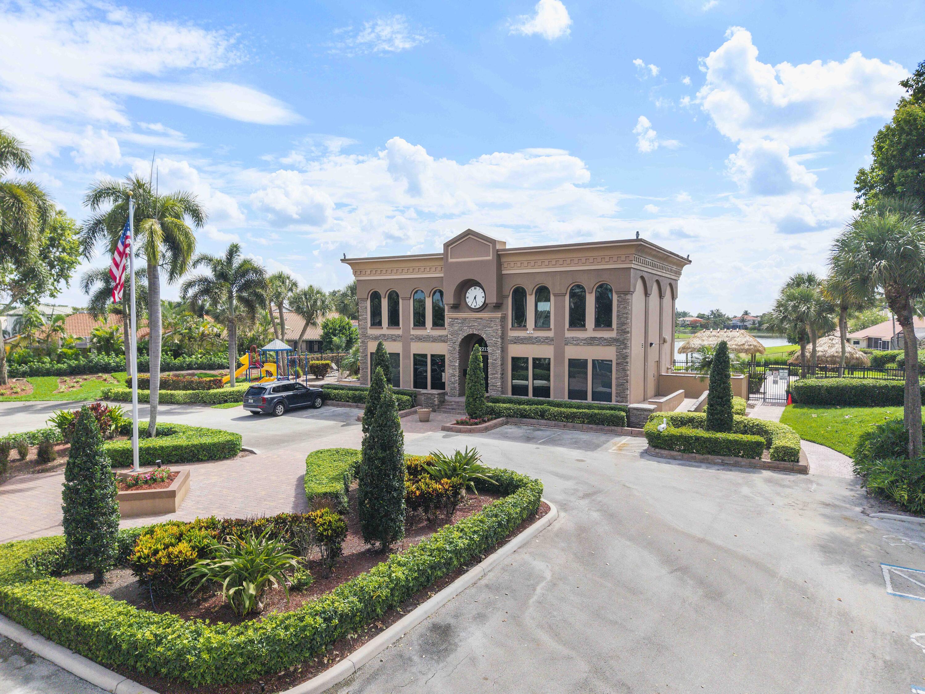 12328 St Simon Drive Boca Raton, FL 33428 - Photo 45 of 52 a front view of a house with garden