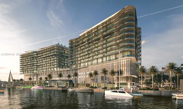a view of tall building with lake view