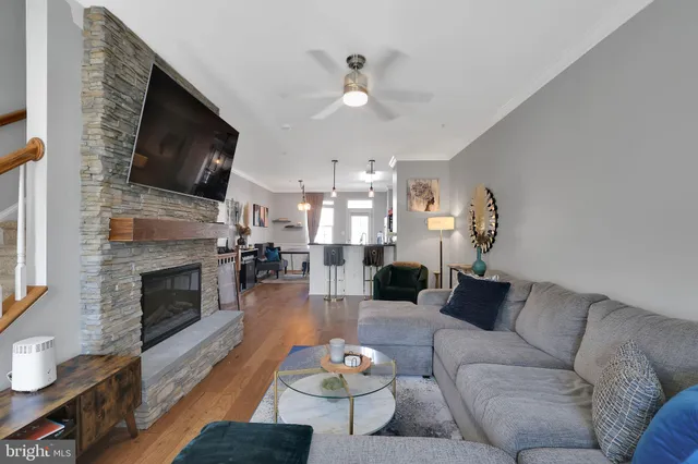 a living room with furniture fireplace and flat screen tv