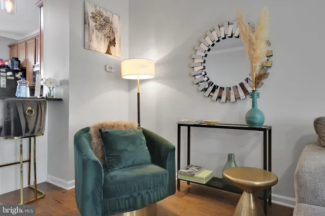a living room with furniture and a mirror