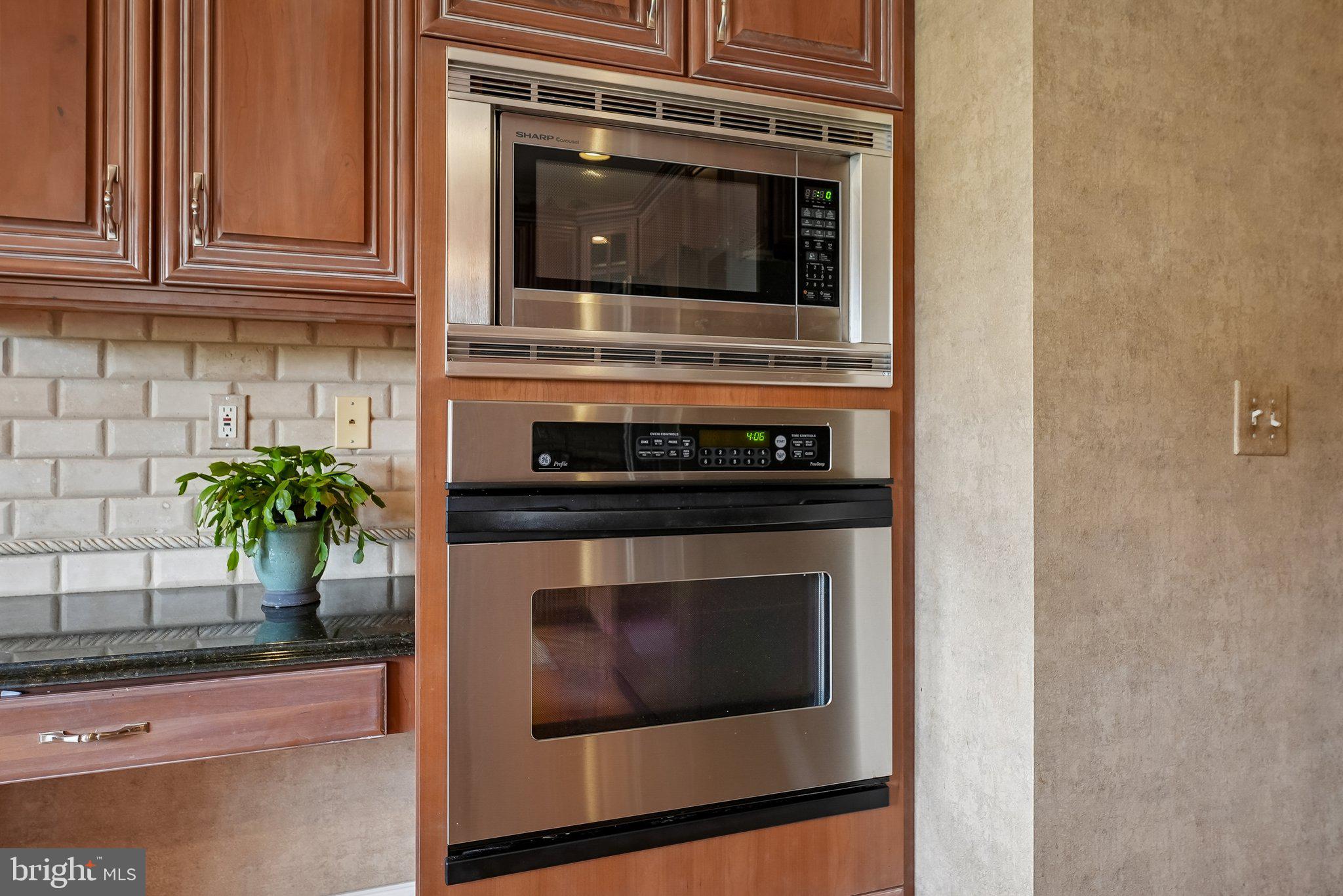 1 Baker Way Pennington, NJ 08534 - Photo 18 of 77 a kitchen with a stove and microwave