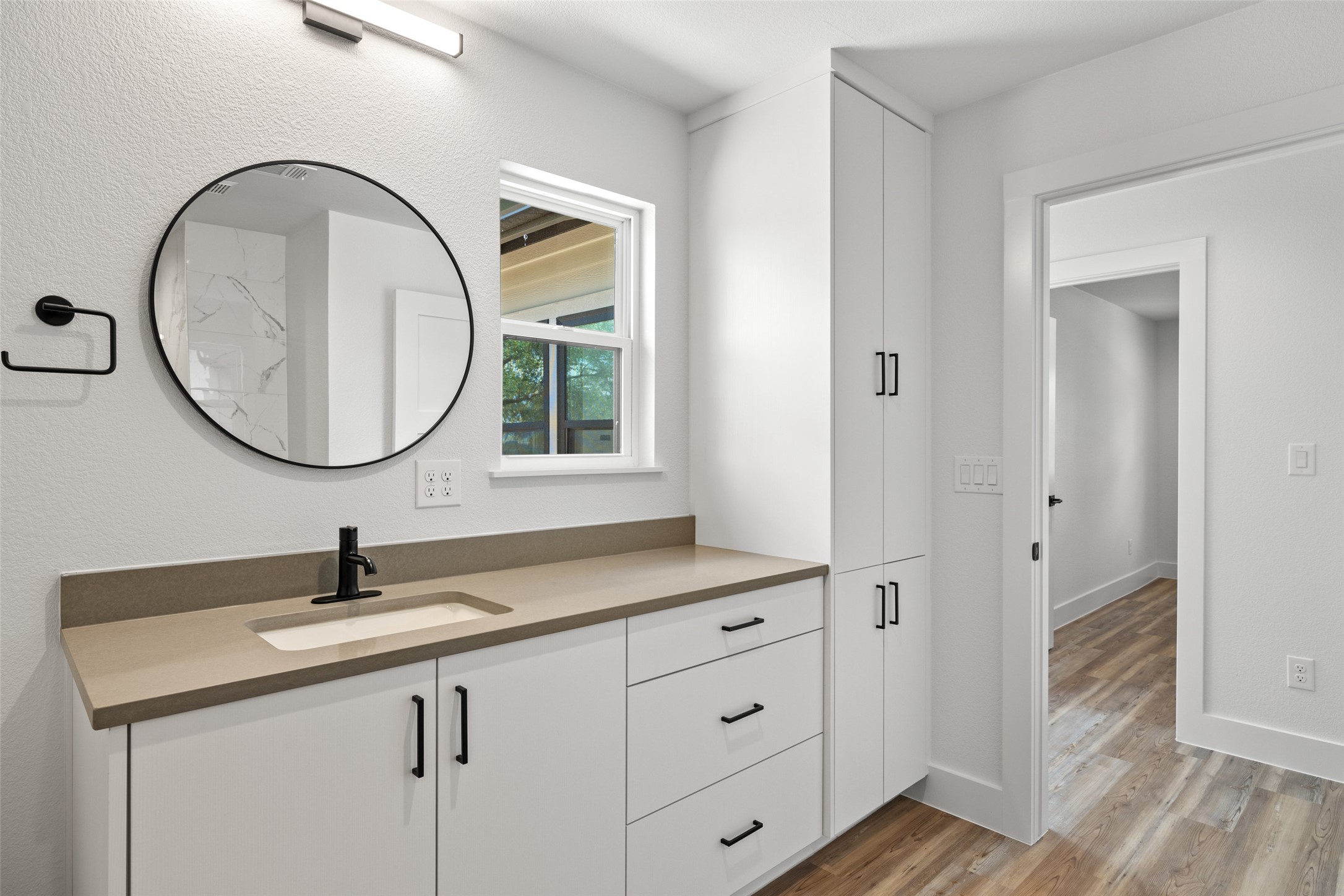 11151 Highway 71 Spicewood, TX 78669 - Photo 25 of 38 Middle Residence - Guest bathroom feature a gorgeous vanity and a tub/shower combo.