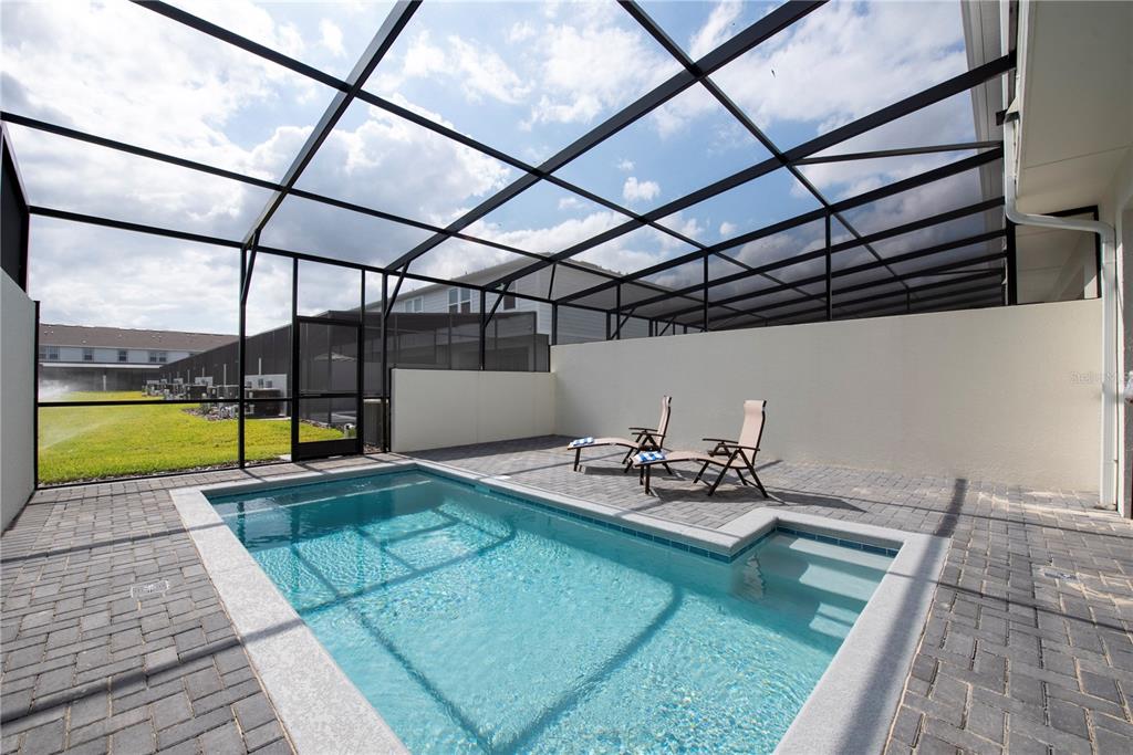 126 Jetty Way Davenport, FL 33897 - Photo 17 of 52 a view of swimming pool with seating area