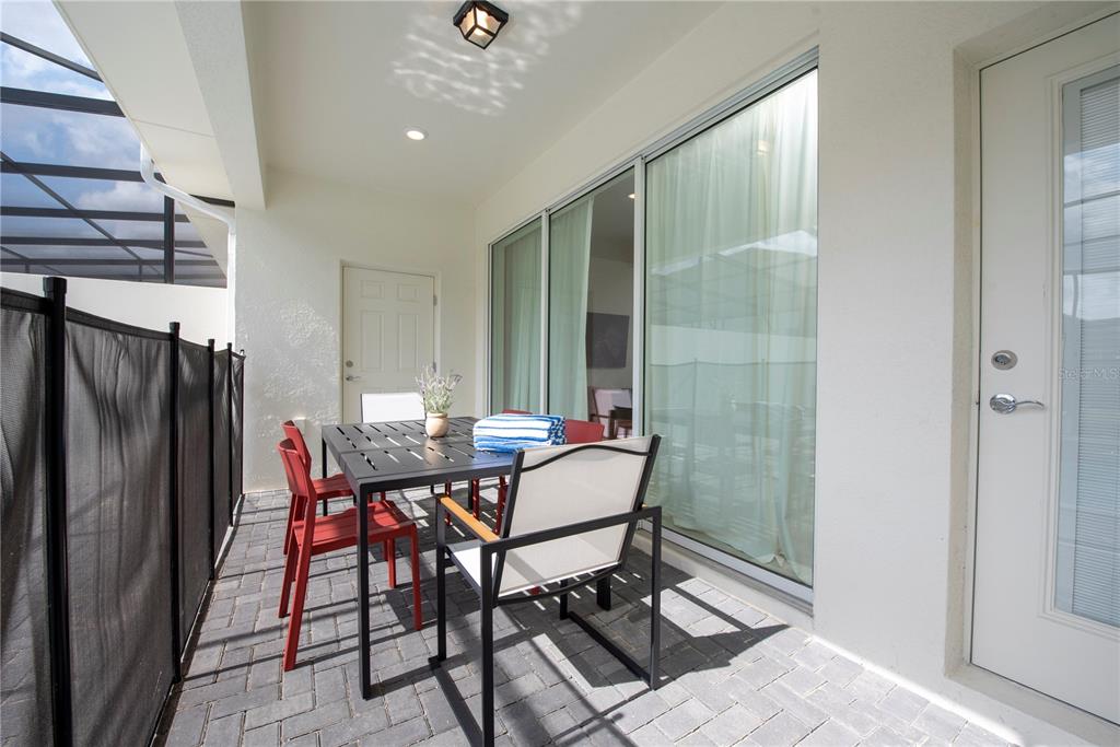 126 Jetty Way Davenport, FL 33897 - Photo 20 of 52 a view of a dining room with furniture and a chandelier