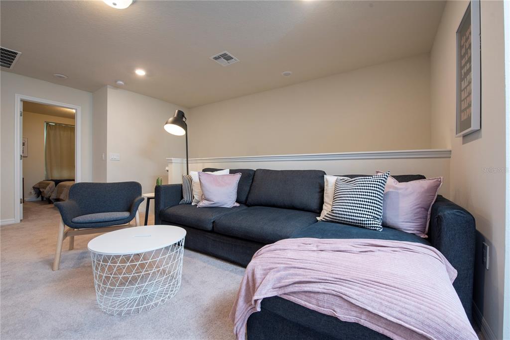 126 Jetty Way Davenport, FL 33897 - Photo 24 of 52 a living room with furniture