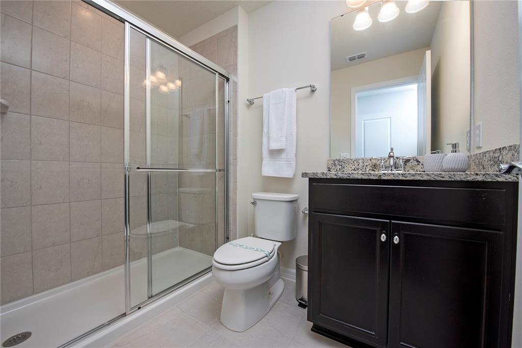 126 Jetty Way Davenport, FL 33897 - Photo 32 of 52 a bathroom with a sink a toilet and shower