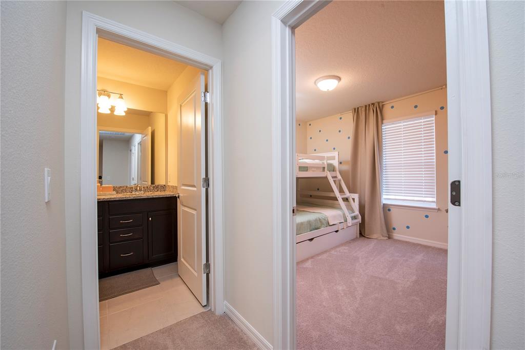 126 Jetty Way Davenport, FL 33897 - Photo 35 of 52 a view of a hallway and a livingroom with furniture