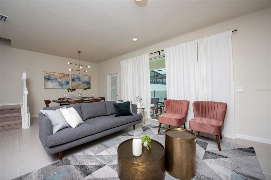 126 Jetty Way Davenport, FL 33897 - Photo 5 of 52 a living room with furniture and a large window
