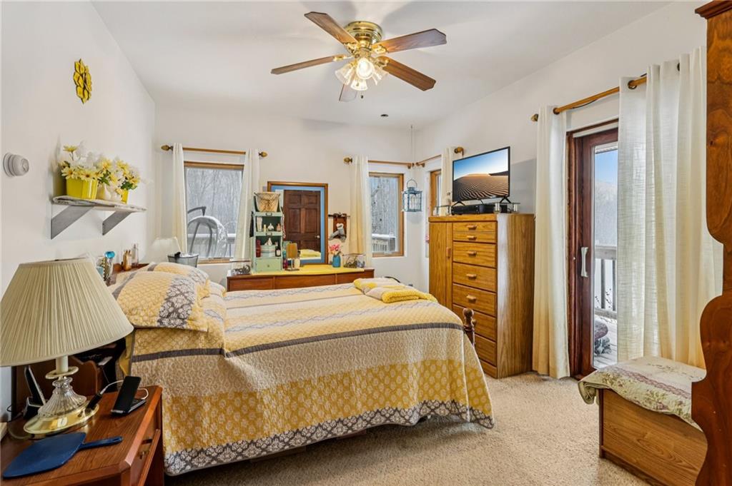 199 Anglers Rest Lane Utica, PA 16362 - Photo 20 of 49 a bedroom with a bed and wooden floor