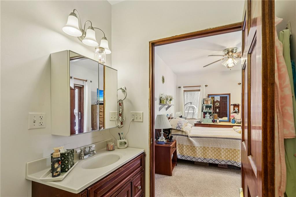 199 Anglers Rest Lane Utica, PA 16362 - Photo 21 of 49 a en suite bathroom with a double vanity sink a mirror and a shower