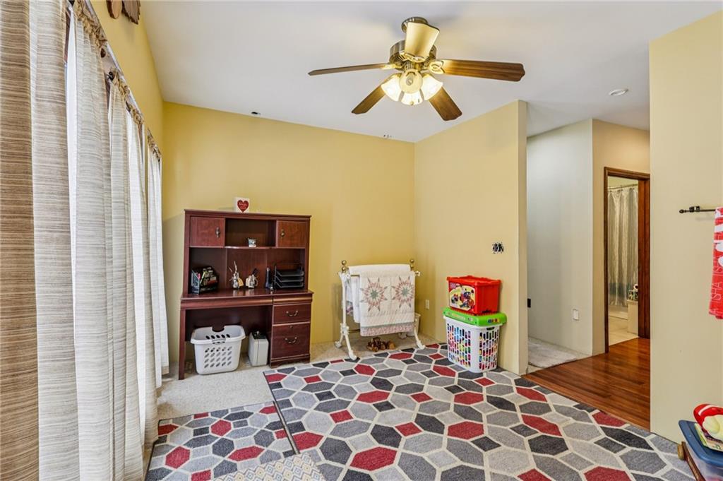 199 Anglers Rest Lane Utica, PA 16362 - Photo 22 of 49 a bedroom with a bed and a chandelier
